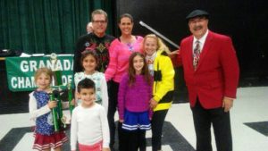 Honorary Mayor of Granada Hills, Dr. Carl Melnik presenting the John V Ciccarelli Founder Sweepstakes Parade Award for "Best Use of Parade Theme" to School Spirit Cheer Calabash Serrania - Welby Way   (The 2016 Parade Theme - Favorite Ugly Holiday Sweaters and Christmas Ties!)