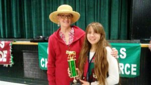 Granada Hills Holiday Parade Judges Coordinator Leslie Strong presenting an Equestrian Trophy amongst the outstanding equine parade entries! 